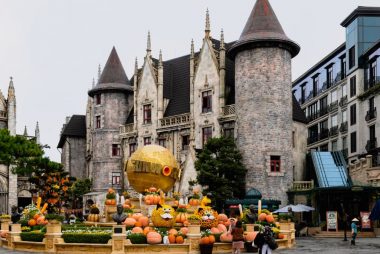 Charming castle with festive pumpkins at Ba Na Hills, Da Nang, Vietnam, perfect for a magical travel experience.